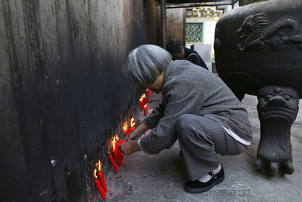 Pilgrims lighting red candles, Island of Putuo Shan, Zhejiang Province, China, Asia