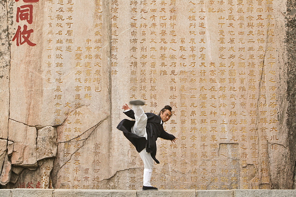 Taoist monk Zhang Qingren demonstrating Tai Ch infront of a famous inscription from Emperor Xuanzong, Hou Shi Wu Temple, Mount Tai, Tai Shan, Shandong province, World Heritage, UNESCO, China