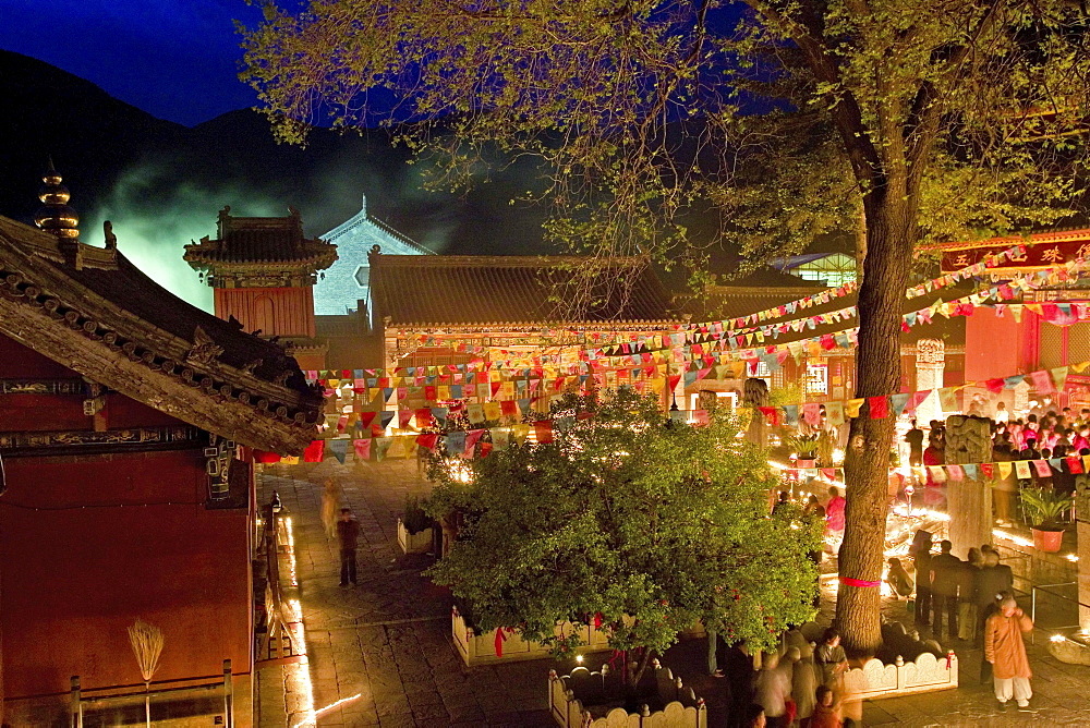 People lighting candles for the birthday celebrations of Wenshu, Shuxiang temple, Mount Wutai, Wutai Shan, Five Terrace Mountain, Buddhist Centre, town of Taihuai, Shanxi province, China