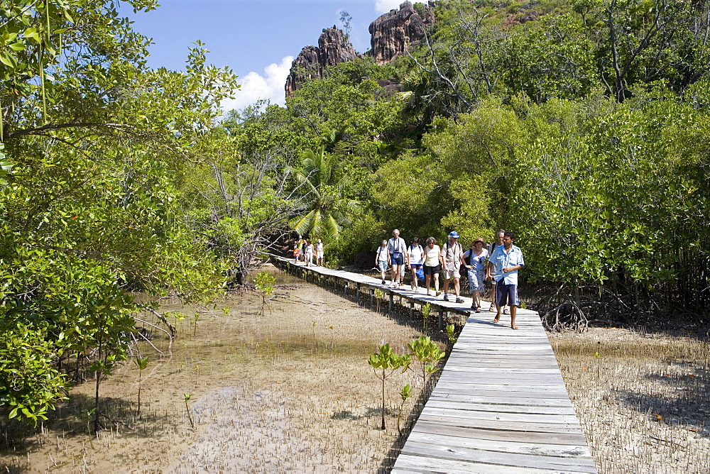 Visitors on Curieuse Island Mangrove Boardwalk, Curieuse Marine National Park, near Praslin Island, Seychelles