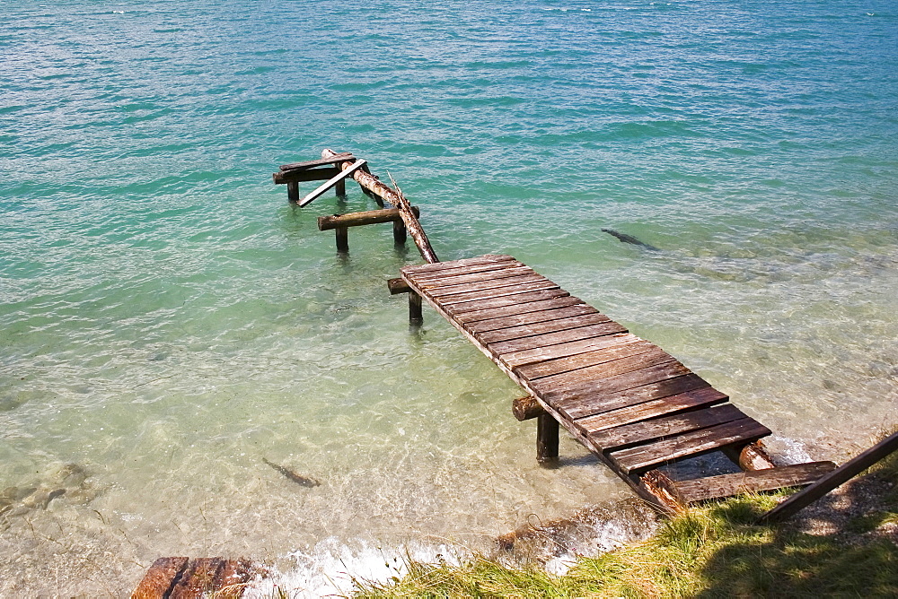 Derelict footbridge at lake, Upper Bavaria, Germany