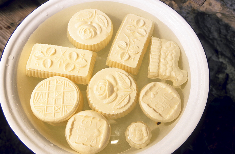 Handmade butter with ornaments in on bowl of water for cooling, Fellalm, Upper Bavaria, Bavaria, Germany