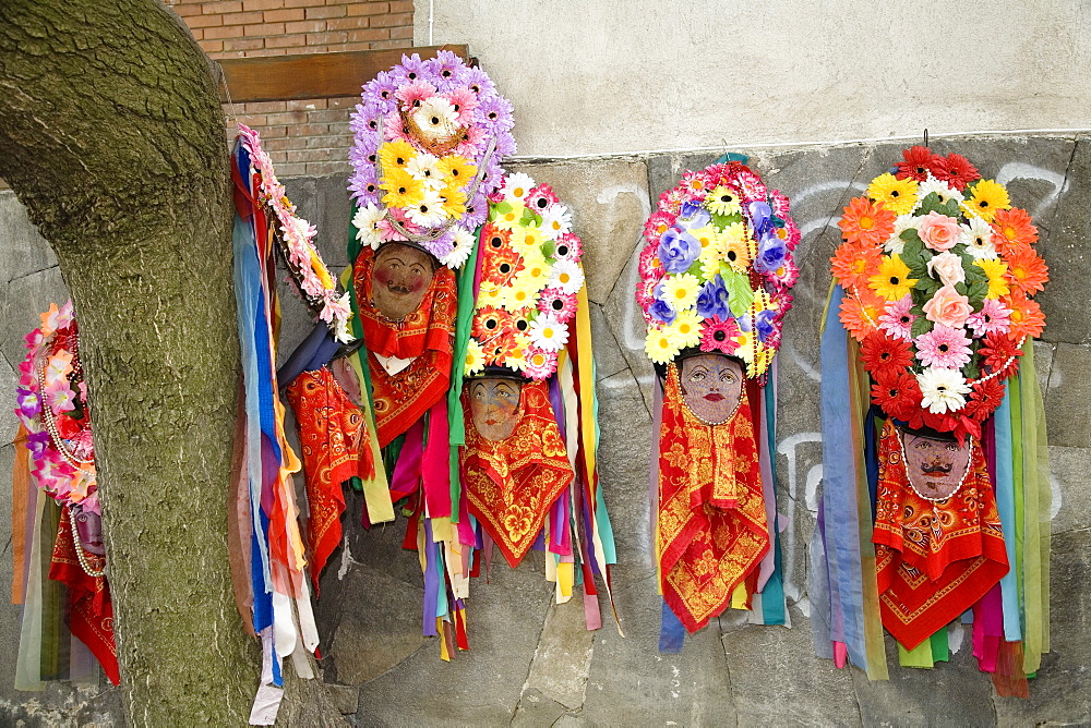 Rose Festival, masks on wall, Karlovo, Bulgaria, Europe