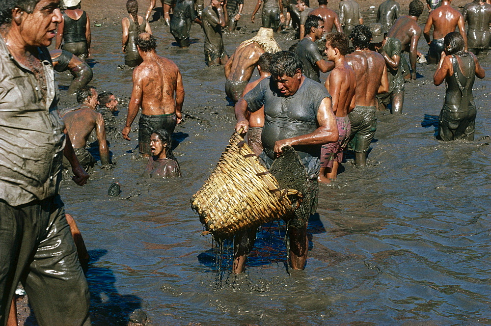 Fiesta del Charco, Festivity of the Pond, funny and muddy fishing competition, early in September, San NicolÂ·s de Tolentino, Gran Canaria, Canary Islands, Spain