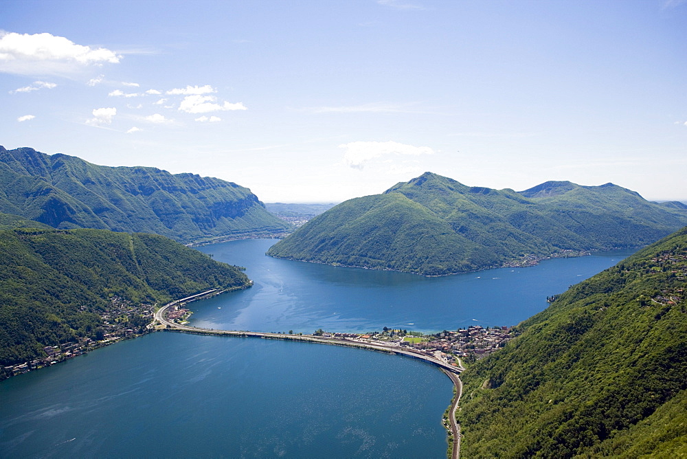 Panoramic view from Monte San Salvatore (912 m) over Motorway, Lake Lugano and Lugano, Ticino, Switzerland