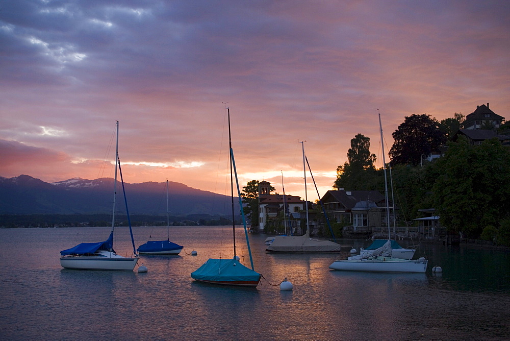 Anchoring sailing boats at surnise near Castle Oberhofen, Lake Thun, Oberhofen, Bernese Oberland (highlands), Canton of Bern, Switzerland