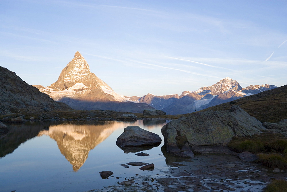 East side (Hoernligrat) of Matterhorn (4478 m) reflected in Riffelsee, Zermatt, Valais, Switzerland