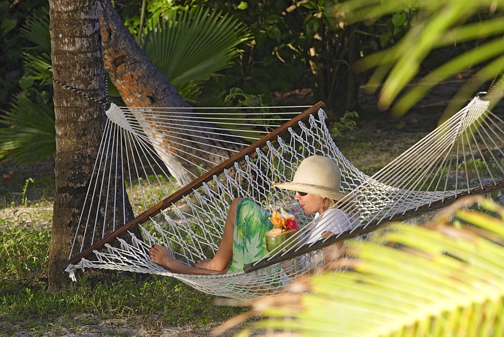 Woman with Drink in Hammock, Tonga, South Seas