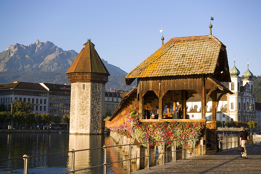 River Reuss with Kapellbruecke (chapel bridge, oldest covered bridge of Europe) and Wasserturm, Jesuit church, first large sacral baroque building in Switzerland, Pilatus in background, Lucerne, Canton Lucerne, Switzerland