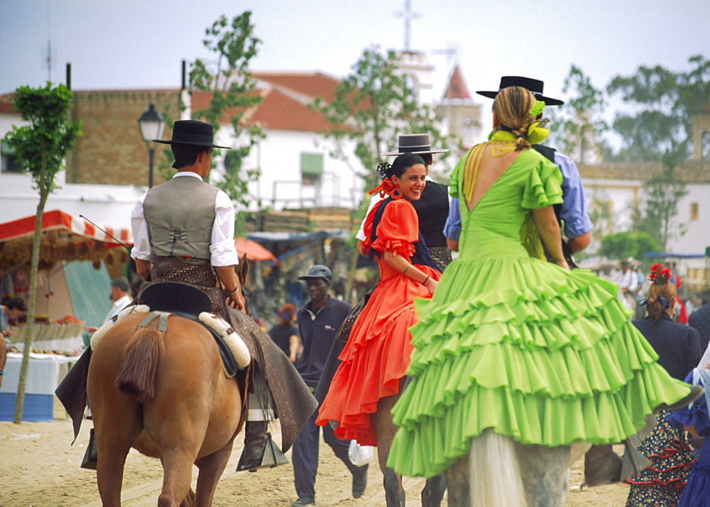 Spain, Andalucia, El Rocio, horse rirs in flamenco style at whitsan festival