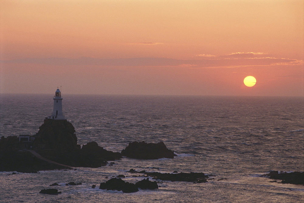 View of Corbiere Lighthouse at sunset, in the evening, Jersey, Channel Islands, Great Britain