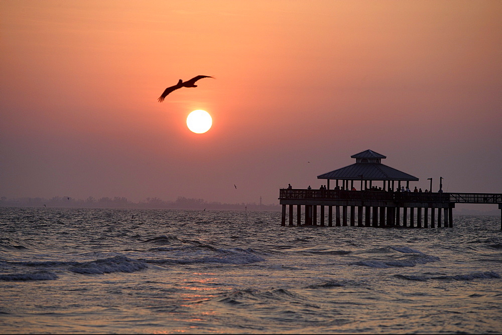 Sunset and the pier of Fort Myers Beach, Florida, USA