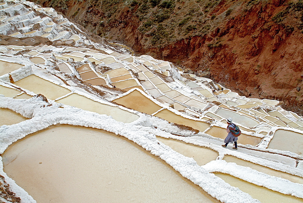 Inca woman in the salt pans of Salinas, Valle Sagrado de los Inca, Sacred Valley, Peru, Soth America