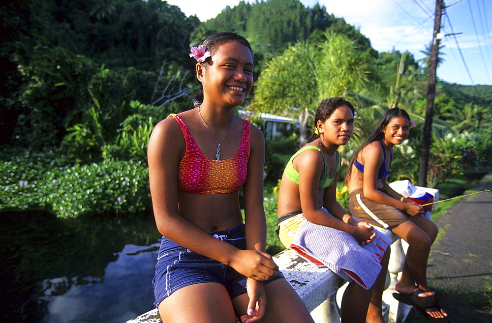 Three local girls along the coast road, Tahiti, French Polynesia, south sea