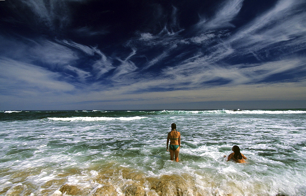 Two women swimming at Wreck Beach, Great Ocean Walk, Victoria, Australia