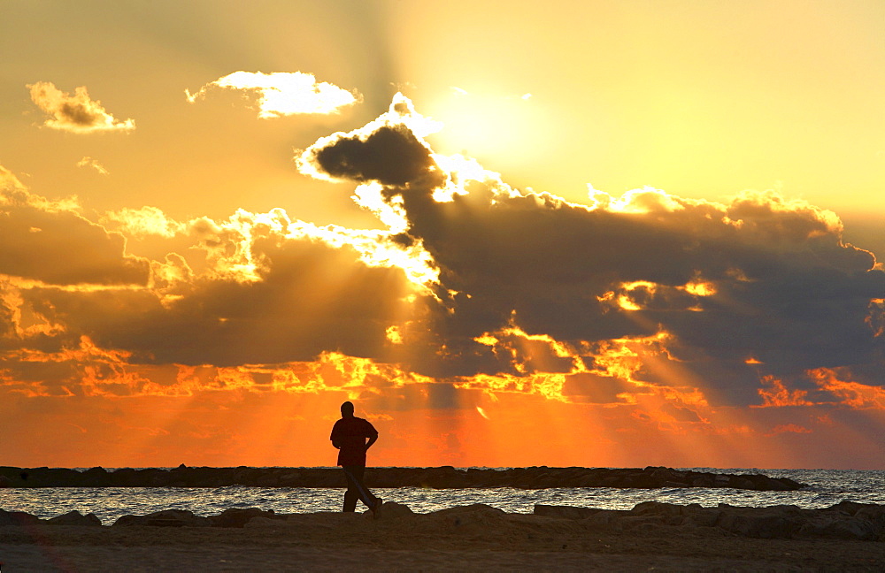 Jogger in sunset, Mediterranean, Tel Aviv, Israel