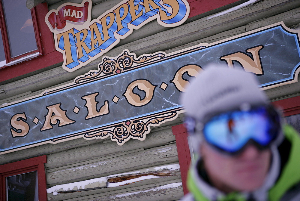 Skier in front of Mad Trappers Saloon, Ski Resort, Sunshine Village, Alberta, Canada