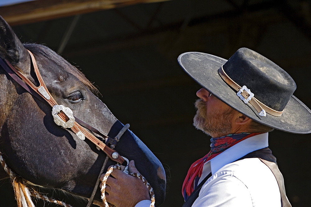 cowboy with horse at stable, wildwest, Oregon, USA