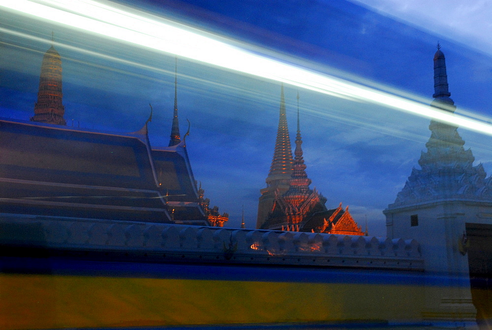 Evening traffic in front of Wat Phra Kaeo Temple, Bangkok, Thailand