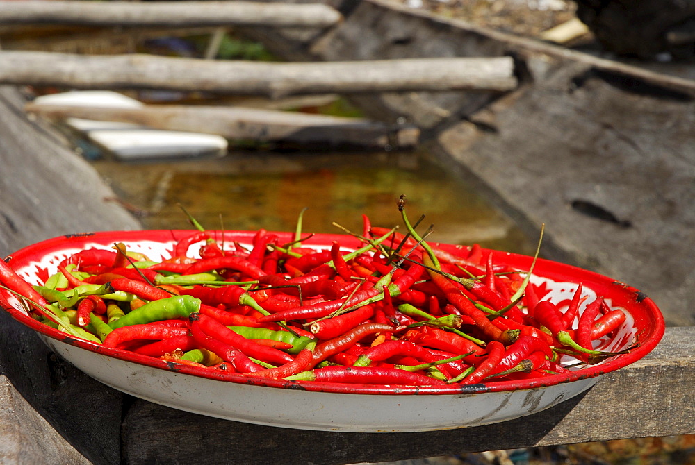 Hot as hell, Chilli peppers, Chillis drying in a pan, Chao Nam village, Surin Islands Marine National Park, Ko Surin, Phang Nga, Thailand