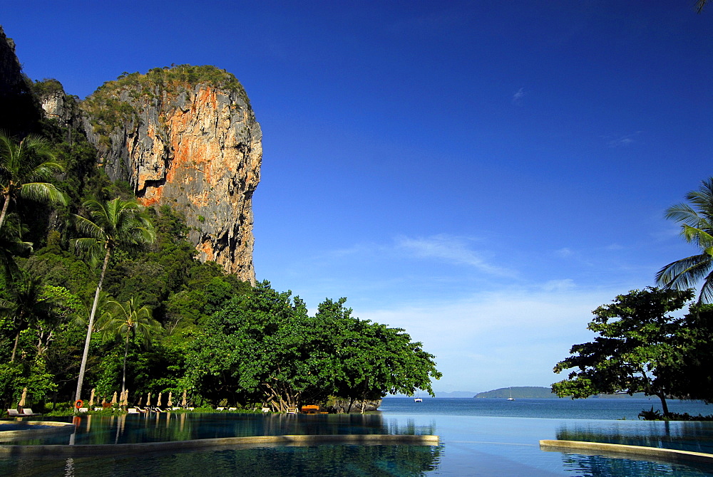 Pool in tropical garden of Hotel Rayavadee with limestone cliffs, Hat Phra Nang, Krabi, Thailand