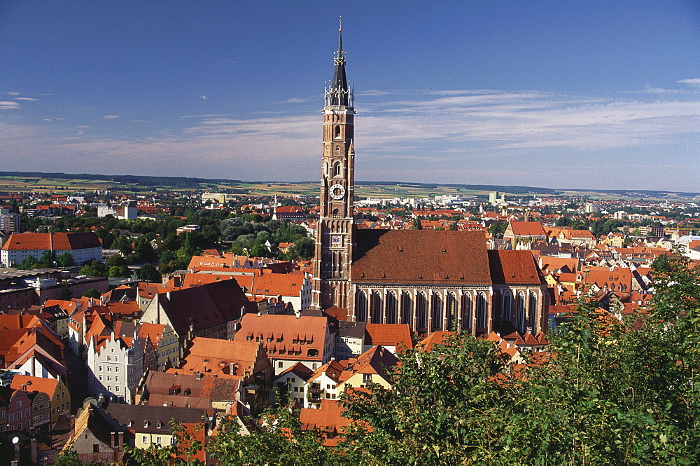 Towers and roofs of the medieval town surrounding the brick church and tower of St Martin, Landshut, Lower Bavaria, Germany