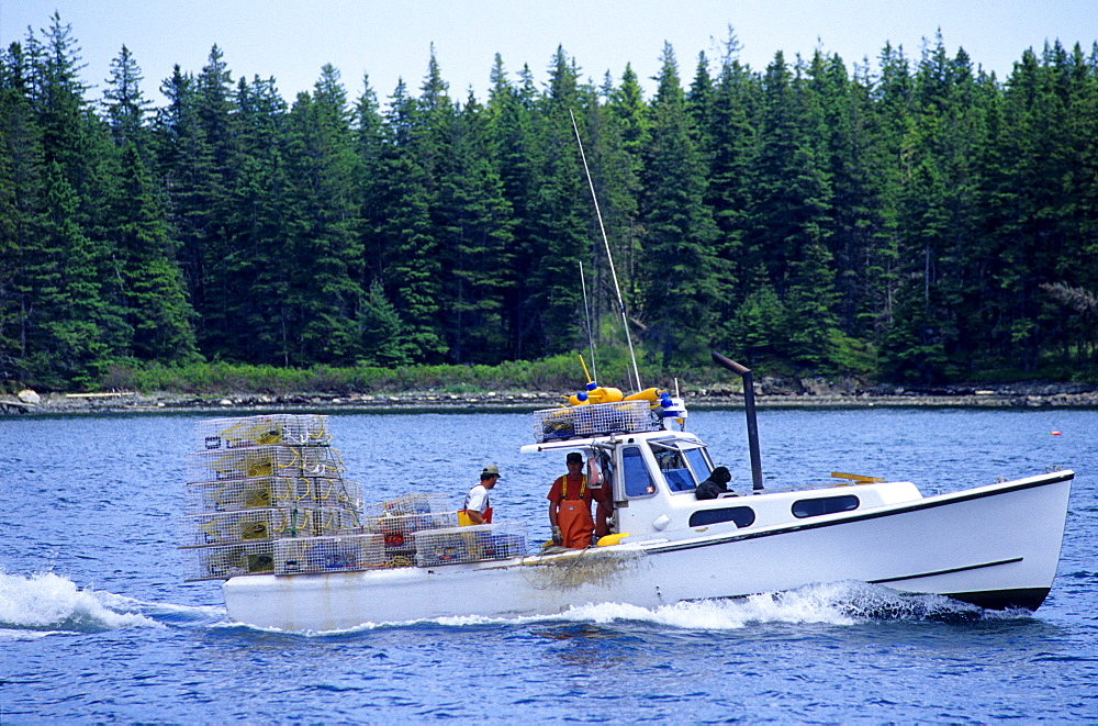 Fishing boat carrying lobster traps, Maine, USA