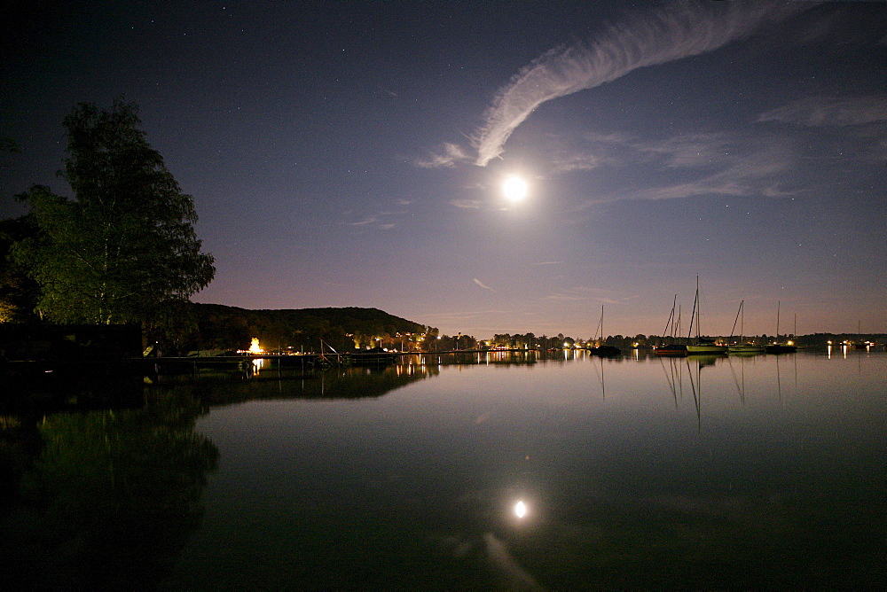 Refelction of the moon and sailing boats in the lake, Steinebach, Lake Woerthsee, Ipper Bavaria, Bavaria, Germany