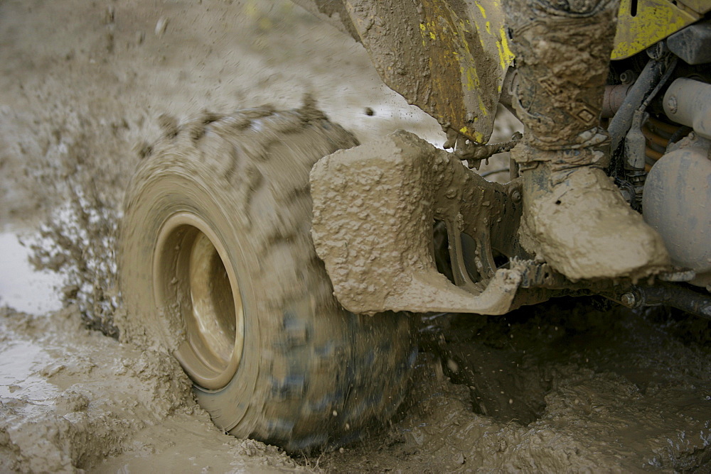 Man driving Suzuki Quad through mud, Test Grounds, Suzuki Offroad Camp, Valencia, Spain