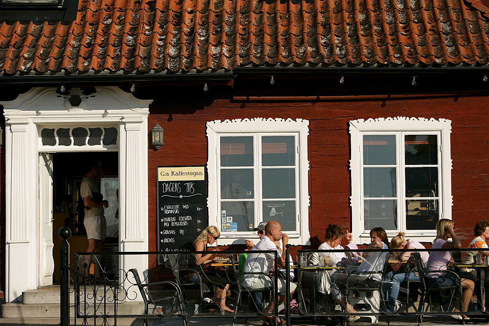 People sitting outside a street cafe, Kaffestugan, Visby, Gotland, Sweden