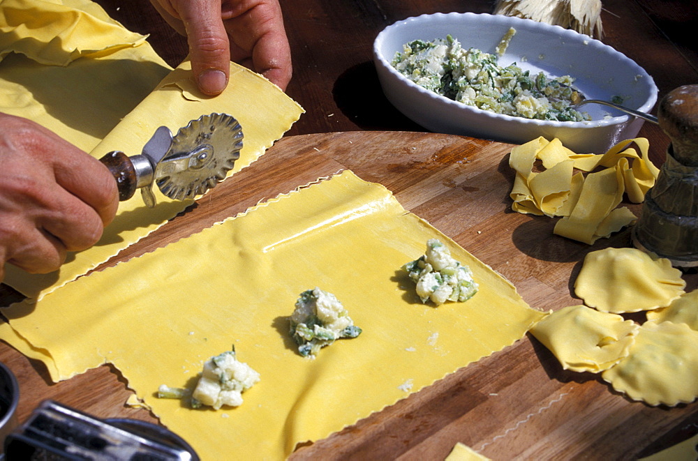 Man preparing pasta, restaurant La Campagnola, Salo, Lake Garda, Lombardy, Italy