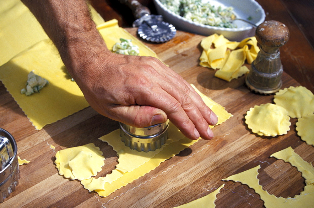 Man preparing pasta, restaurant La Campagnola, Salo, Lake Garda, Lombardy, Italy