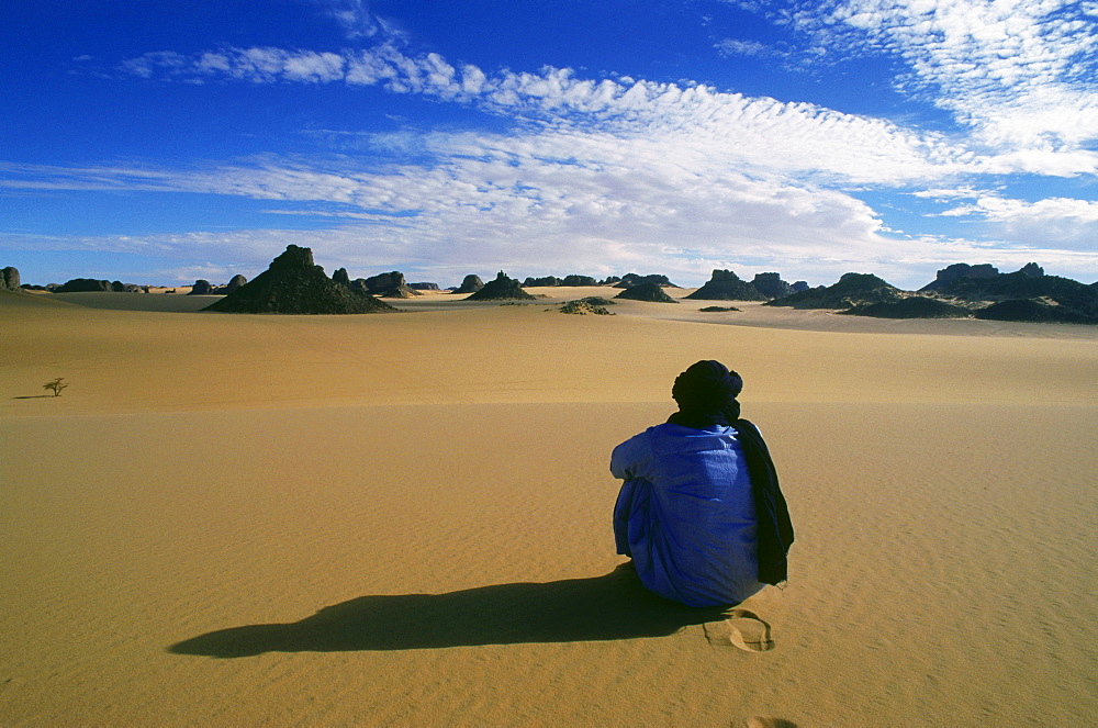 Berber People cowering in the sand, Tassili N' Ajjer, algerian Sahara, Algeria, Africa