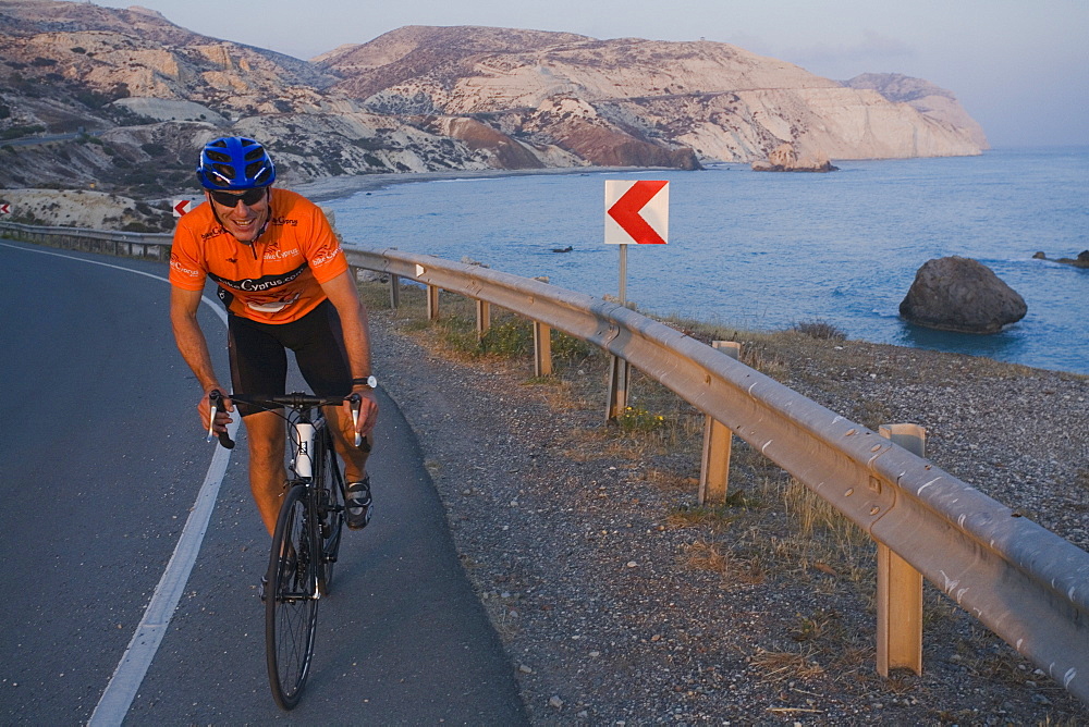 Man bicycling at Petra tou Romiou, Aphrodites birthplace, Petra tou Romiou, Cyprus