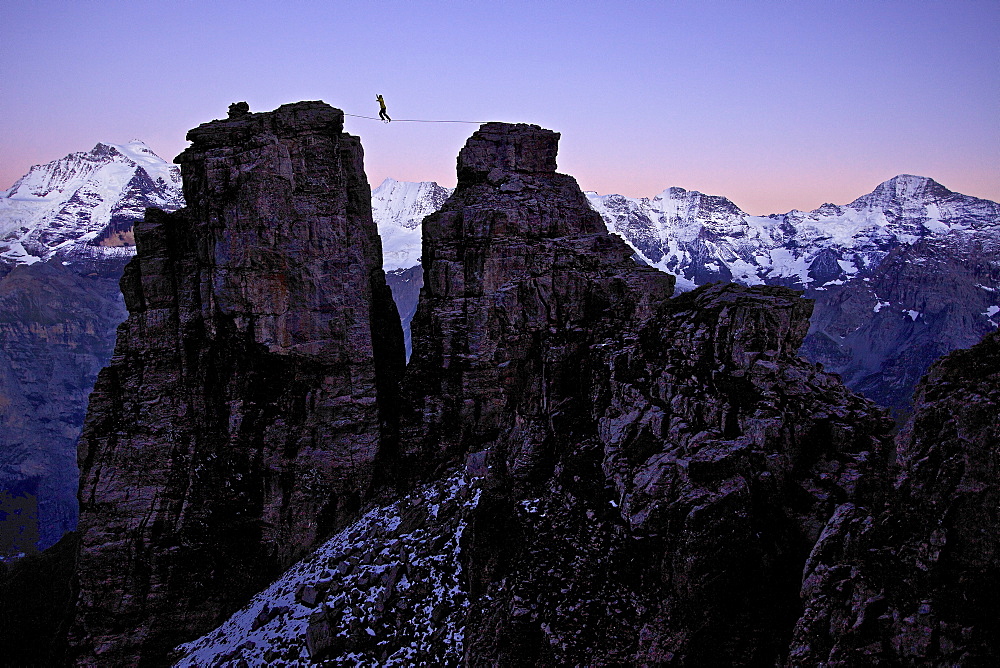 Man walking a highline between two rocks, Schilthorn, Bernese Oberland, Canton of Bern, Switzerland