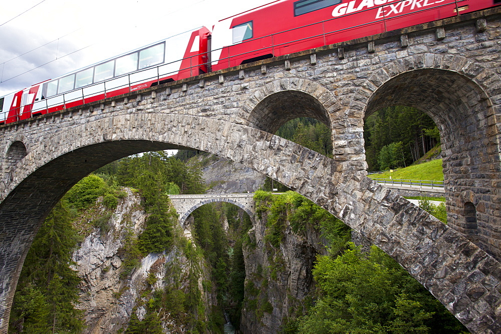 Train, Glacier Express, crossing the Solis Bridge over Schyn gorge, Graubuenden, Switzerland