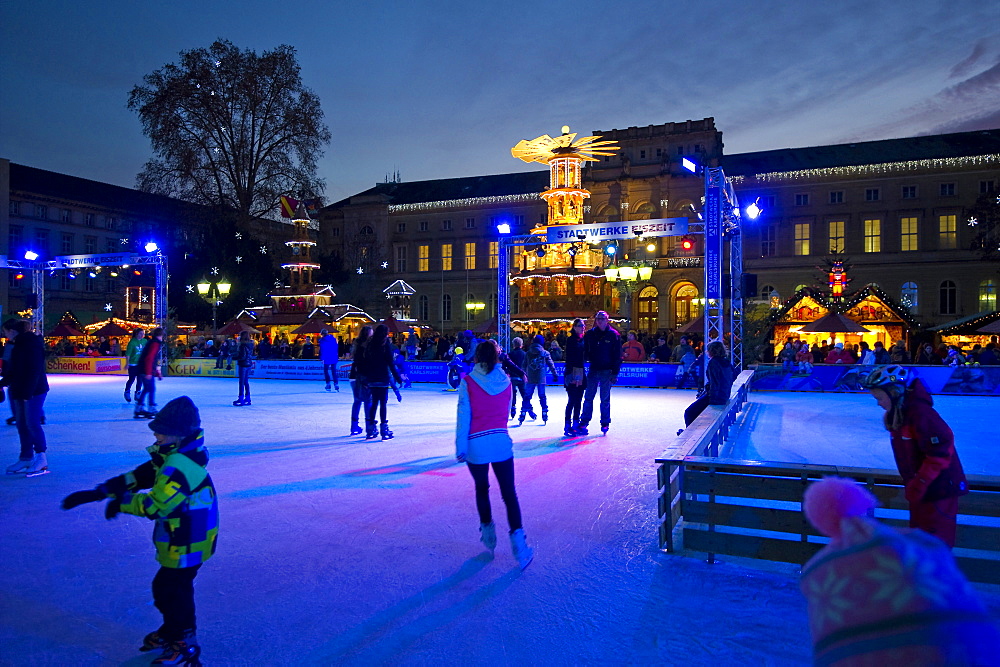 People ice skating at the Christmas market, Karlsruhe, Baden-Wuerttemberg, Germany