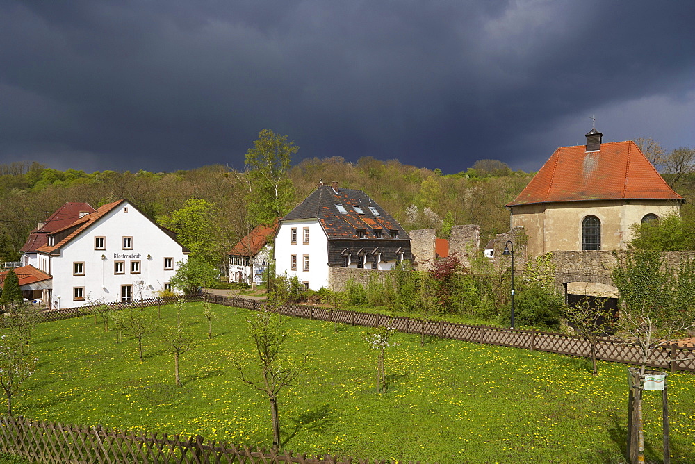 Graefinthal with rest of former Wilhelmiten monastery under thunder clouds, Mandelbachtal, Bliesgau, Saarland, Germany, Europe