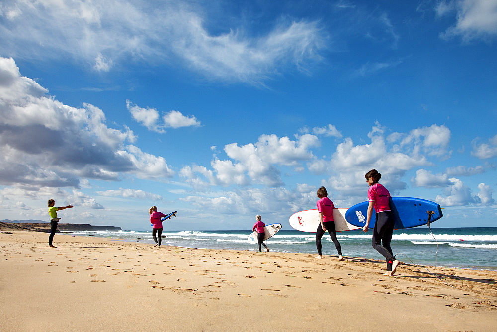 Surfer at beach, El Cotillo, Fuerteventura, Canary Islands, Spain