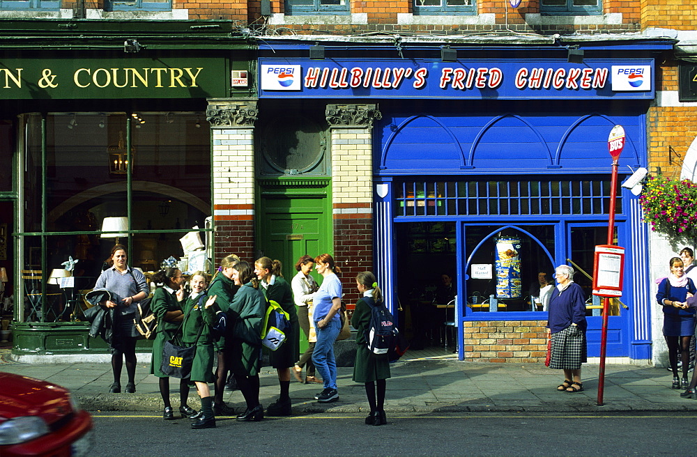 People standing at a bus stop, Cobh, County Cork, Ireland, Europe