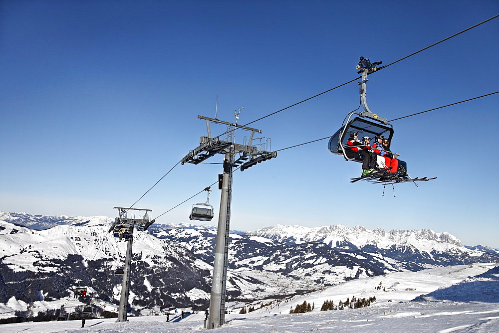 Skier in the chair lift, Ski Resort Pengelstein, Lift, Kirchberg, Kitzbuhel, Tyrol, Austria