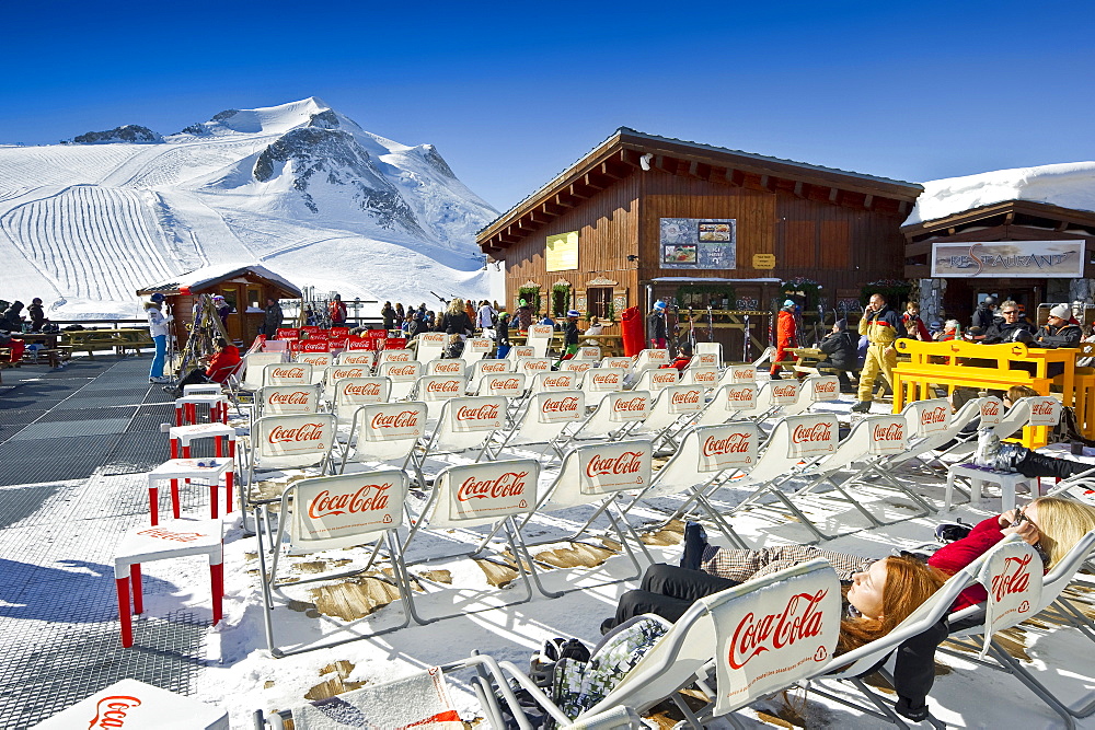 Deck chairs outside a mountain restaurant, Tignes, Val d Isere, Savoie department, Rhone-Alpes, France