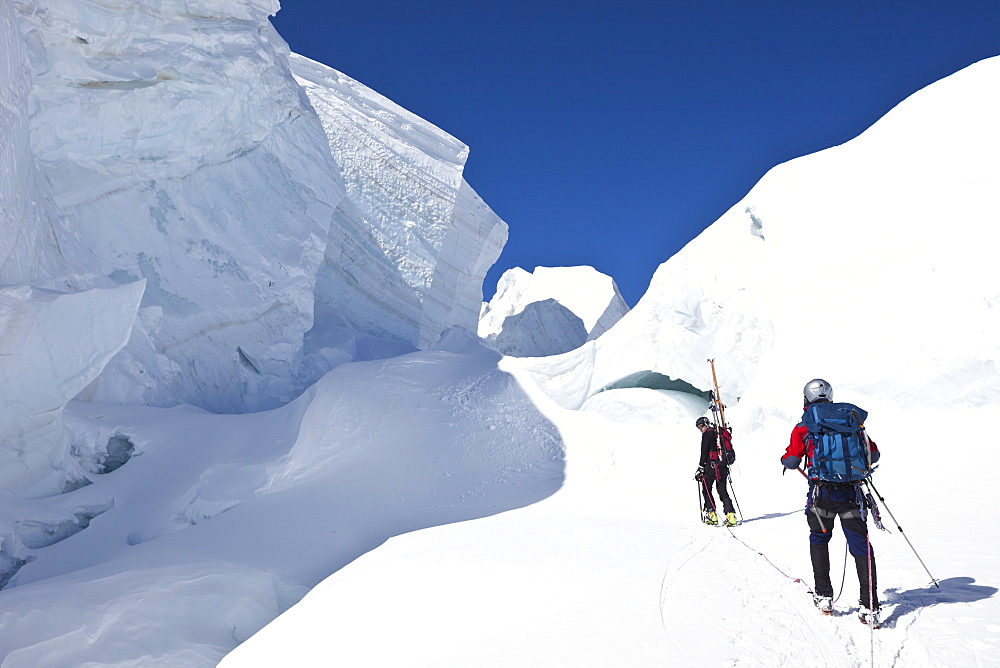 Ski mountaineers in a crevasse, Mont Blanc du Tacul, Chamonix, Mont-Blanc, France