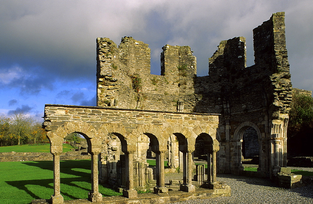 The ruins of Mellifont abbey under dark clouds, County Louth, Ireland, Europe