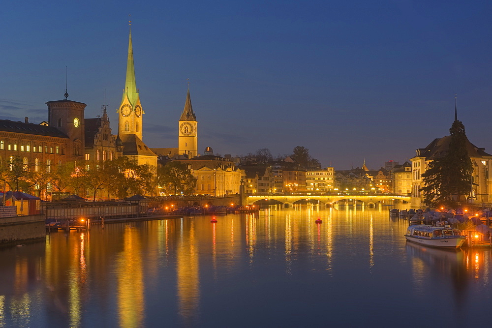 Limmat with Fauenmunster and St Peter church, dusk, Zurich, Switzerland