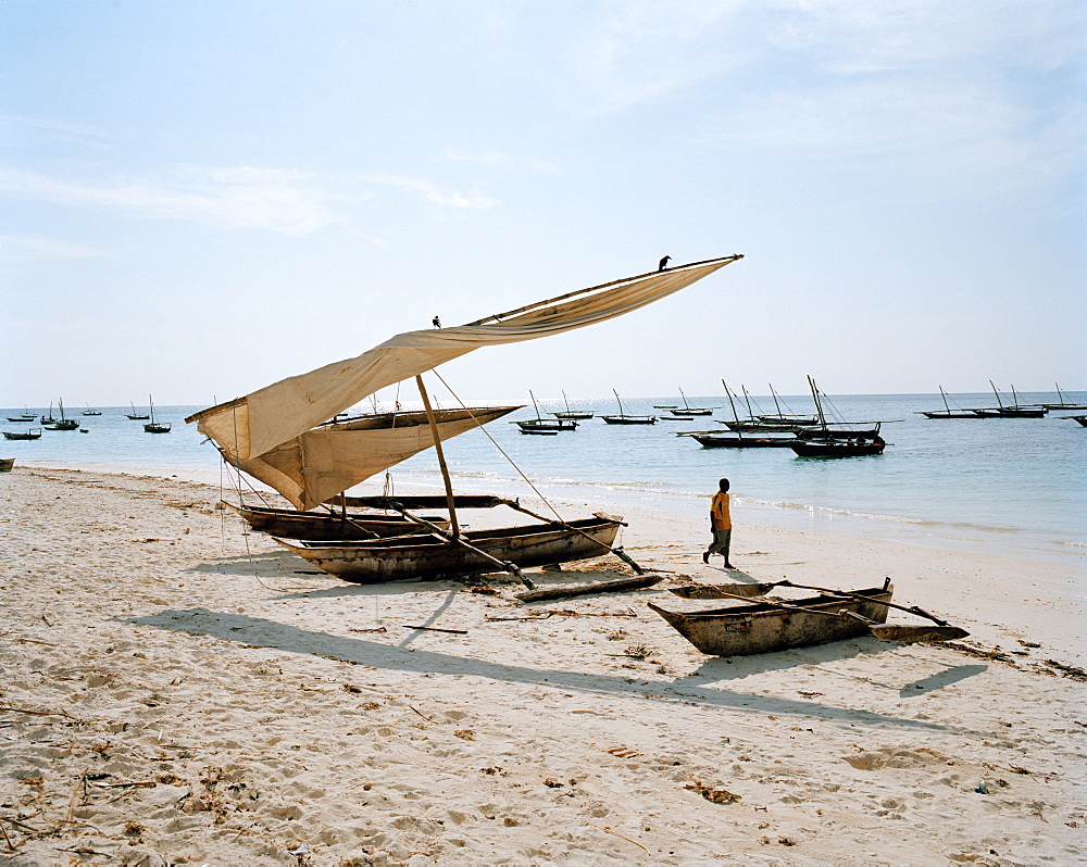 Traditional fishing canoe's laying on the beach of Nungwi, northern Zanzibar, Tanzania, East Africa