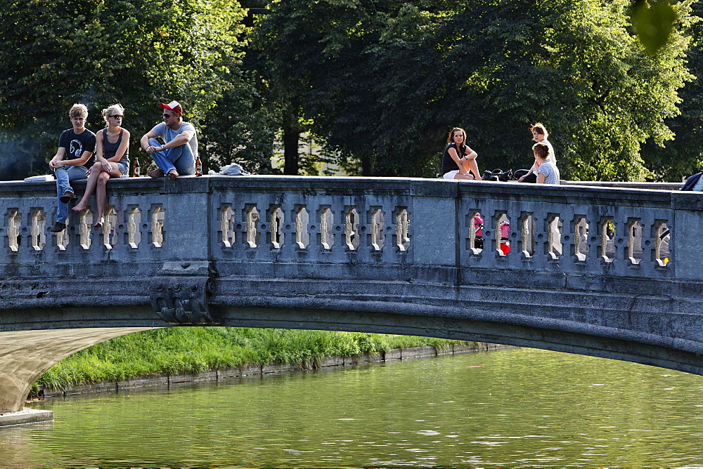 People on a bridge above the Nymphenburg canal, Gern, Munich, Upper Bavaria, Bavaria, Germany, Europe