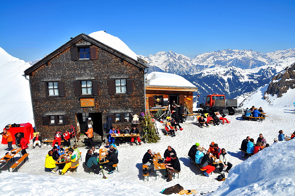 People in front of Wormser hut under the Hochjoch, ski area Silvretta Montafon in the Montafon, Vorarlberg, Austria, Europe