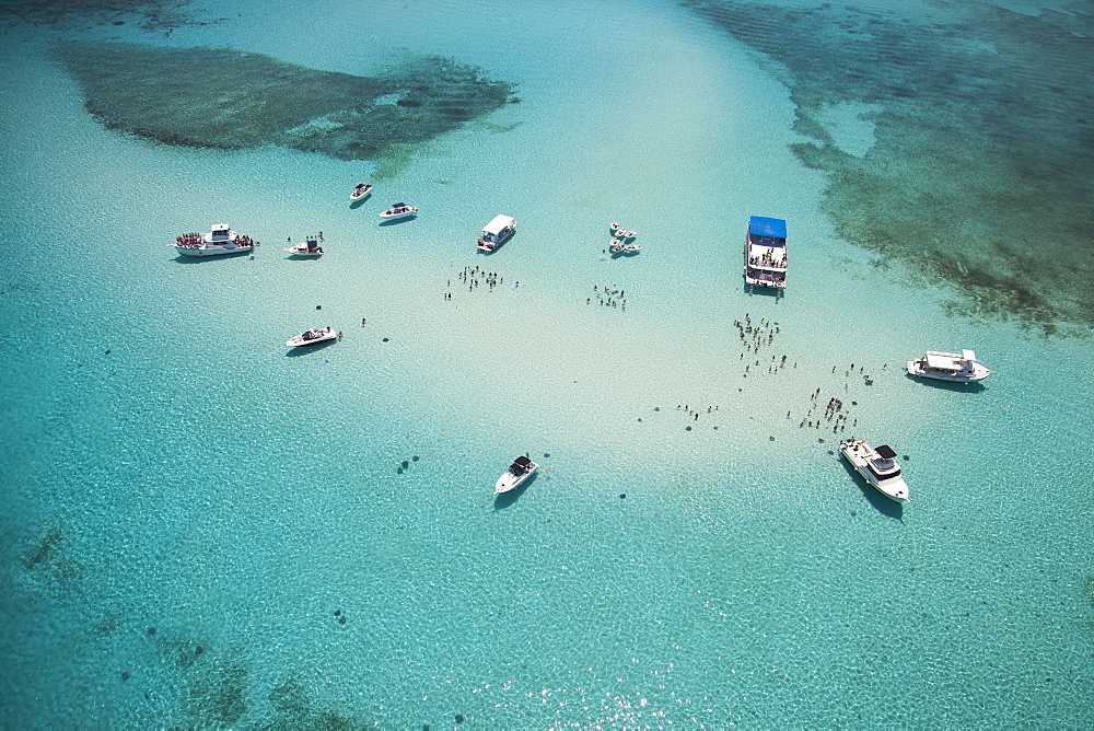 Aerial view of Stingray City sand bank with excursion boats and people swimming, Grand Cayman, Cayman Islands, Caribbean