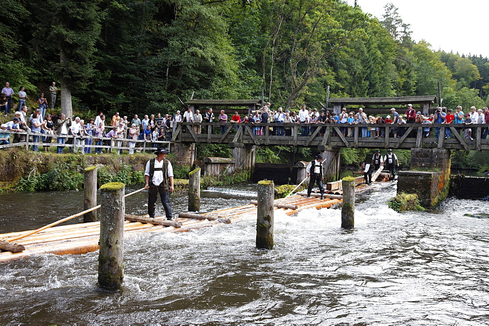 Men in traditional costumes on a raft, Timber rafting festival, Altensteig, River Nagold, Northern Black Forest, Baden Wurttemberg, Germany, Europe